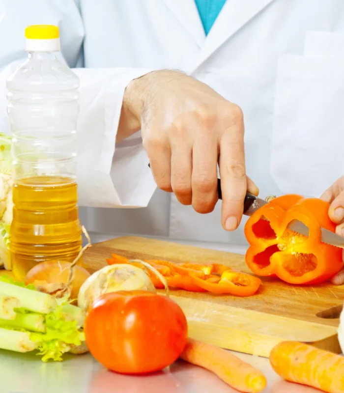 cook-cuts-pepper-cutting-board-2048x1365